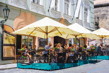 PRAGUE, CZECH REPUBLIC - MAY 2017: Tourists outside cafe, restaurant in the old town of Prague.のeditorial素材