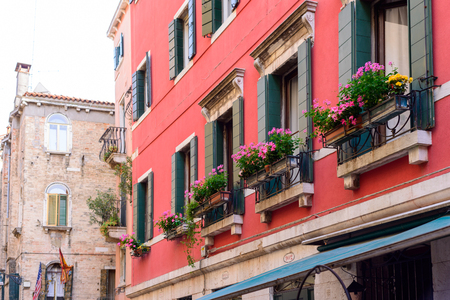 VENICE, ITALY - MAY, 2017: Flower boxes below a window in Venice, Italyのeditorial素材