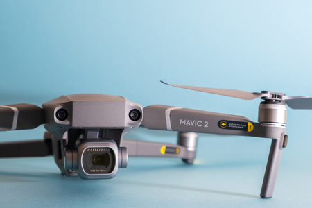 ST. PETERSBURG, RUSSIA - MARCH, 2019: DJI Mavic 2 pro with Hasselblad camera against blue background - an andvanced prosumer drone.のeditorial素材