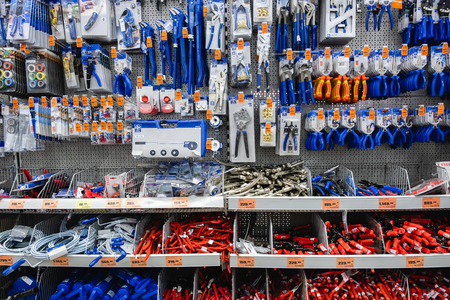 ST. PETERSBURG, RUSSIA - MARCH, 2019: shelf with power tools in the store OBI. Necessary tools for small repairs in everyday life.のeditorial素材