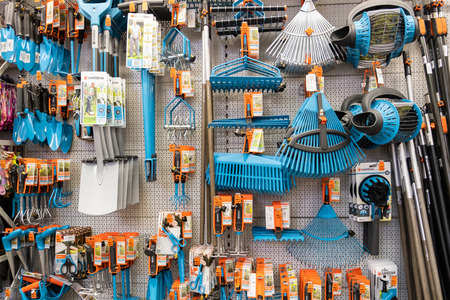ST. PETERSBURG, RUSSIA - MARCH, 2019: shelf of a garden shop with the tools to care for a plot of land works.のeditorial素材