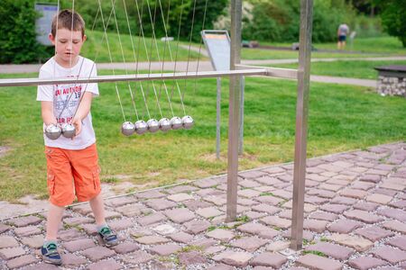 KRAKOW, POLAND - JUNE 17: Museum of Science in the open air. Park. The boy is studying physical...
