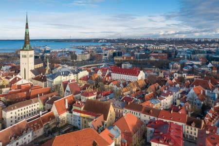 TALLINN, ESTONIA, FEBRUARY 2020: Travel to estonian capital Tallinn, Europe. City Hall tower building. Historical ancient baltic tourists street.のeditorial素材