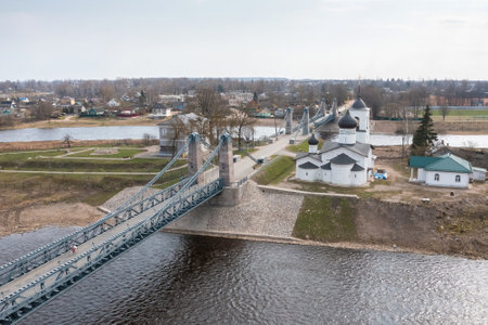 The famous chain bridge and St. Nicholas Church in the town of Ostrov, Pskov region. Tourist place...