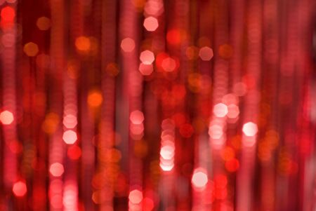 Decorative christmas background - defocused reflection of lights.