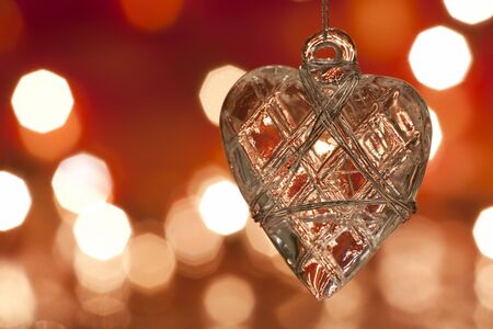 Christmas decoration - glass heart. Blurred lights background. aRGB.の写真素材