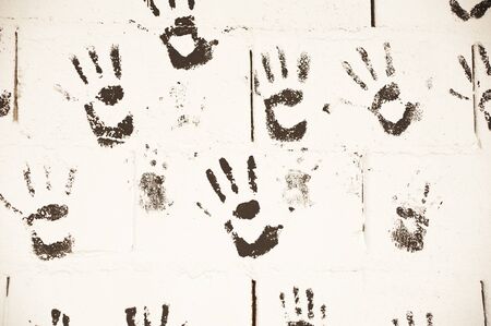 black hand prints in wallの写真素材
