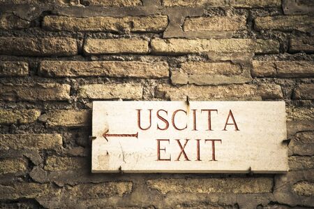 Exit to the left in English and Italianの写真素材