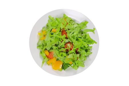 Salad with cucumber tomatoes and yellow pepper isolated on white backgroundの写真素材