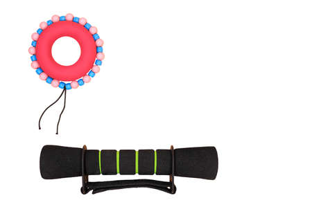 Sports layout of a dumbbell and a hand-held rubber expanderの写真素材