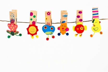 Fantasy Cloth pegs on white backgroundの写真素材