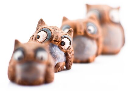 Owl sculpture in white backgroundの写真素材