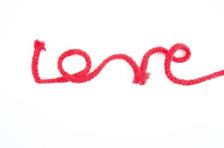 word love from red rope on white back groundの写真素材