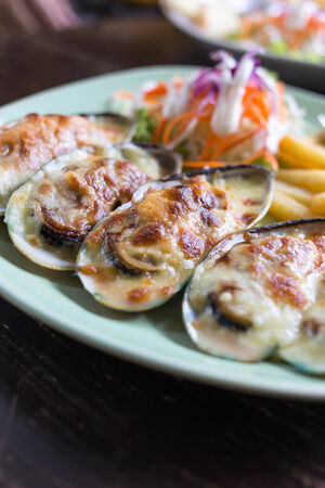 Baked mussels with cheeseの写真素材