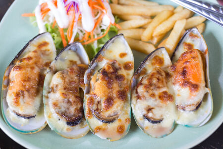 Baked mussels with cheeseの写真素材