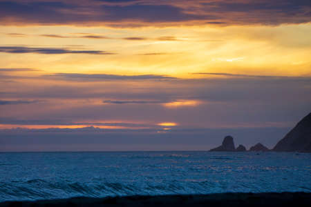 Dramatic Clouds over a dark oceanの写真素材