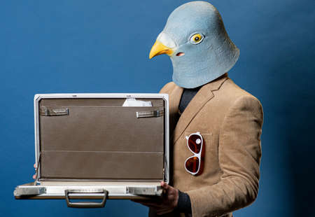 Pigeon Man Wearing Suit With Gold Chainの写真素材