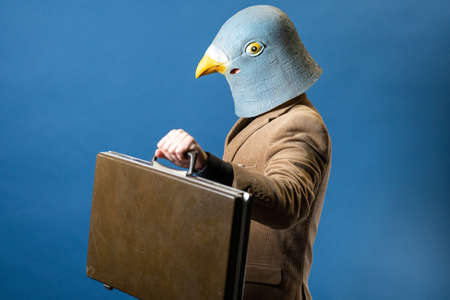 Pigeon Man Wearing Suit With Gold Chainの写真素材