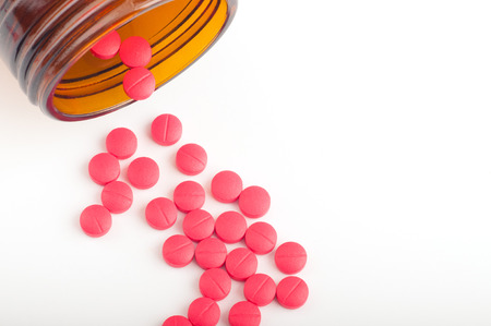 pills pouring out of the bottleの写真素材