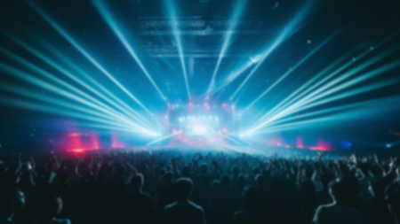 Blur crowd audience watching live show in concert hall or venue stadium with colorful lighting backgroundの素材