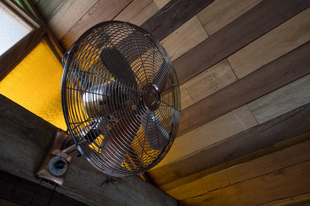 The renovated old vintage fan on the wall, retro styleの写真素材