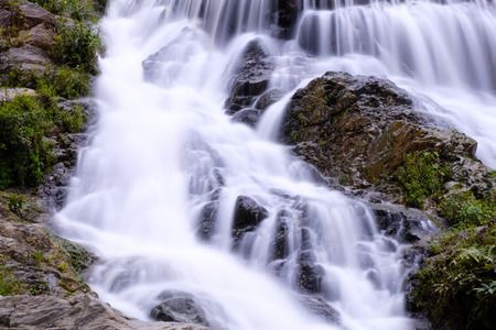 Closeup smooth flow water from Mae Phun waterfalls in Laplae District, Uttaradit province of...