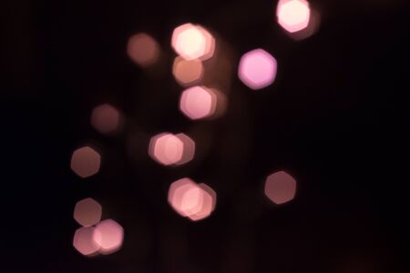 Pink Hexagon bokeh on black background