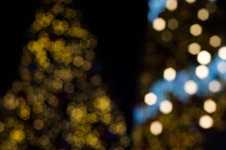 Decorated Christmas tree with bokeh light sparkling in the nightの写真素材