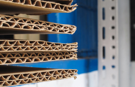 Stack of used brown corrugated cardboard sheet