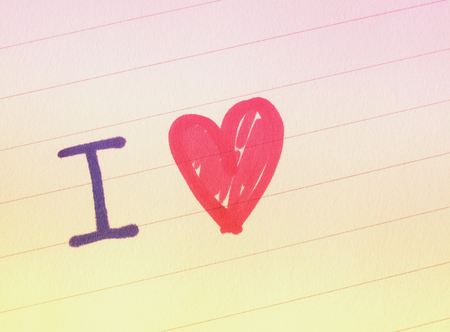 Hand writing on notebook with I love words and hand draw heart shape, colored filter effectの写真素材