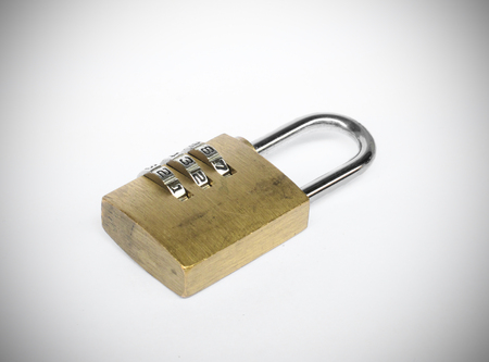 Old golden three dial digit number combination lockの写真素材