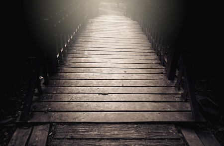 Old wooden bridge over canal with color filter effectの写真素材