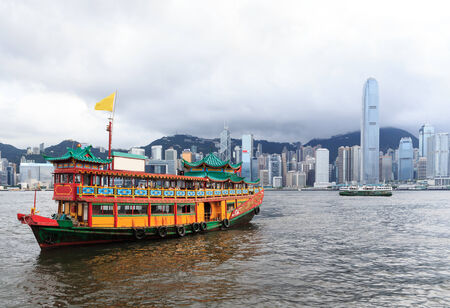 Traditional Chinese Junkboat sailing in Victoria Harbor, Hong Kongのeditorial素材