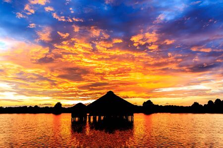Bungalows on the tropical island resort at sunset.のeditorial素材
