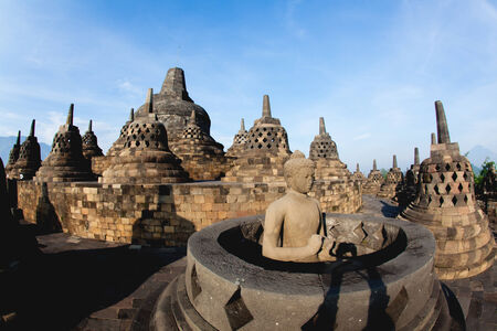 YOGYAKARTA, INDONESIA - DEC 5 : Buddha image on the top of Borobudur on December 5, 2011 in Yogyakarta, Indonesia. Borobudur is a 9th-century Mahayana Buddhist monument in Central Java, Indonesia.のeditorial素材