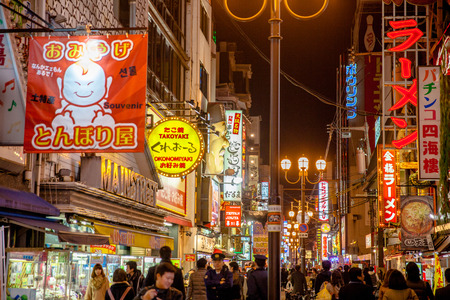 OSAKA,JAPAN- NOVEMBER 28:Night view of the neon advertisements Dotonbori on Nov 28, 2012 in Osaka, Japan.Is famous for its historic theatres,and restaurants, and its many neon and mechanised signsのeditorial素材