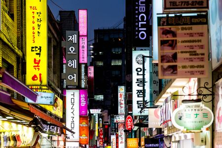 SEOUL - NOVEMBER 5: Myeong-Dong Neon Lights November 5, 2013 in Seoul, South Korea. The location is the premiere district for shopping in the city.のeditorial素材