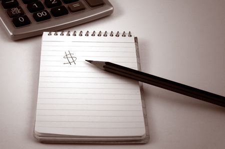Notepad, Pencil and Calculator with Dollar Signの写真素材