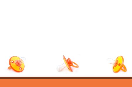 Orange and White Pacifier Backgroundの写真素材