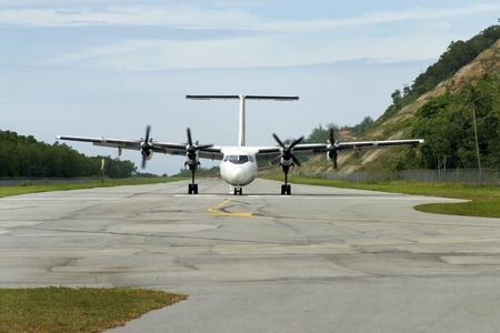 Propellor Plane landing on air strip