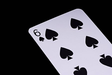 A poker card slanted view over black backgroundの写真素材