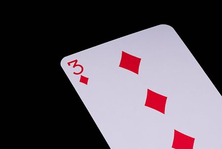 A poker card slanted view over black backgroundの写真素材