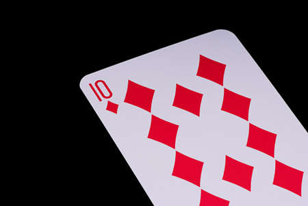 A poker card slanted view over black backgroundの写真素材