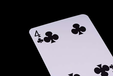 A poker card slanted view over black background