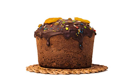 The sweet cake, filled with chocolate and decorated with dried fruits, dried apricots, candied...