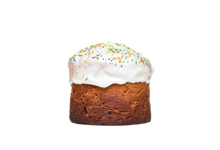 Sweet cake filled with raisins and covered with white icing and colorful toppings. Pancake isolated...