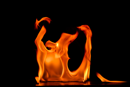 Beautiful fire flames on a black background.の写真素材