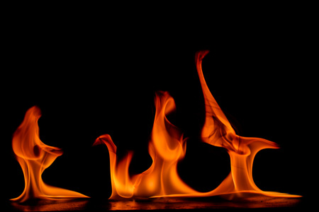 Beautiful fire flames on a black background.の写真素材