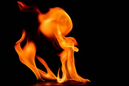 Beautiful fire flames on a black background.の写真素材