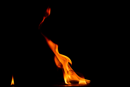 Beautiful fire flames on a black background.の写真素材